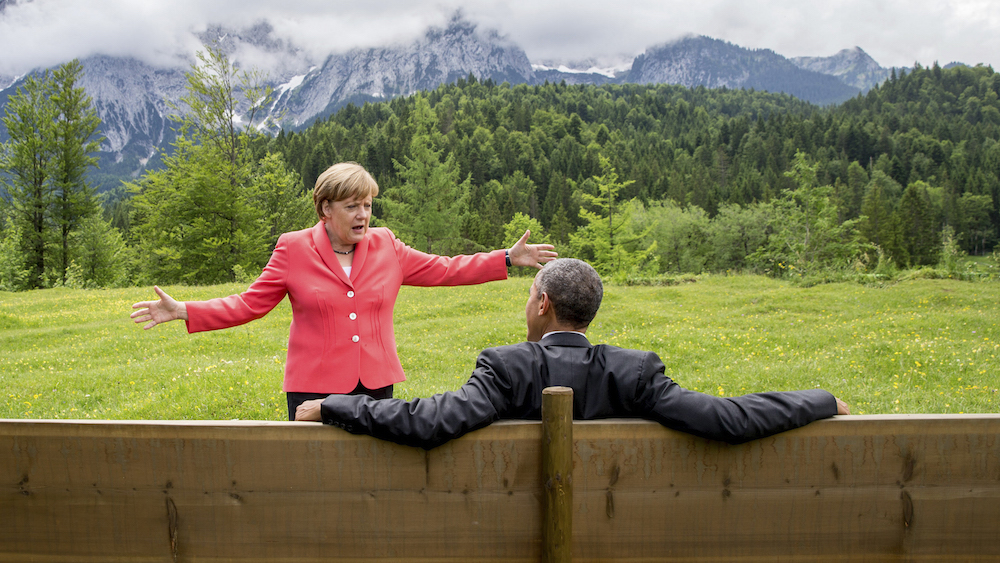 German Chancellor Angela Merkel speaks with U.S. President Barack Obama outside the Elmau castle in Kruen near Garmisch-Partenkirchen, Germany, June 8, 2015. Leaders of the Group of Seven (G7) industrial nations vowed at a summit in the Bavarian Alps on Sunday to keep sanctions against Russia in place until President Vladimir Putin and Moscow-backed separatists fully implement the terms of a peace deal for Ukraine. REUTERS/Michael Kappeler/Pool TPX IMAGES OF THE DAY - RTX1FMFF
