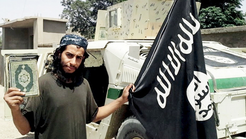 An undated photograph of a man described as Abdelhamid Abaaoud that was published in the Islamic State's online magazine Dabiq and posted on a social media website. A Belgian national currently in Syria and believed to be one of Islamic State's most active operators is suspected of being behind Friday's attacks in Paris, acccording to a source close to the French investigation. "He appears to be the brains behind several planned attacks in Europe," the source told Reuters of Abdelhamid Abaaoud, adding he was investigators' best lead as the person likely behind the killing of at least 129 people in Paris on Friday. According to RTL Radio, Abaaoud is a 27-year-old from the Molenbeek suburb of Brussels, home to other members of the militant Islamist cell suspected of having carried out the attacks. REUTERS/Social Media Website via Reuters TVATTENTION EDITORS - THIS PICTURE WAS PROVIDED BY A THIRD PARTY. REUTERS IS UNABLE TO INDEPENDENTLY VERIFY THE AUTHENTICITY, CONTENT, LOCATION OR DATE OF THIS IMAGE. FOR EDITORIAL USE ONLY. NOT FOR SALE FOR MARKETING OR ADVERTISING CAMPAIGNS. FOR EDITORIAL USE ONLY. THIS PICTURE WAS PROCESSED BY REUTERS TO ENHANCE QUALITY. - RTS7CLF